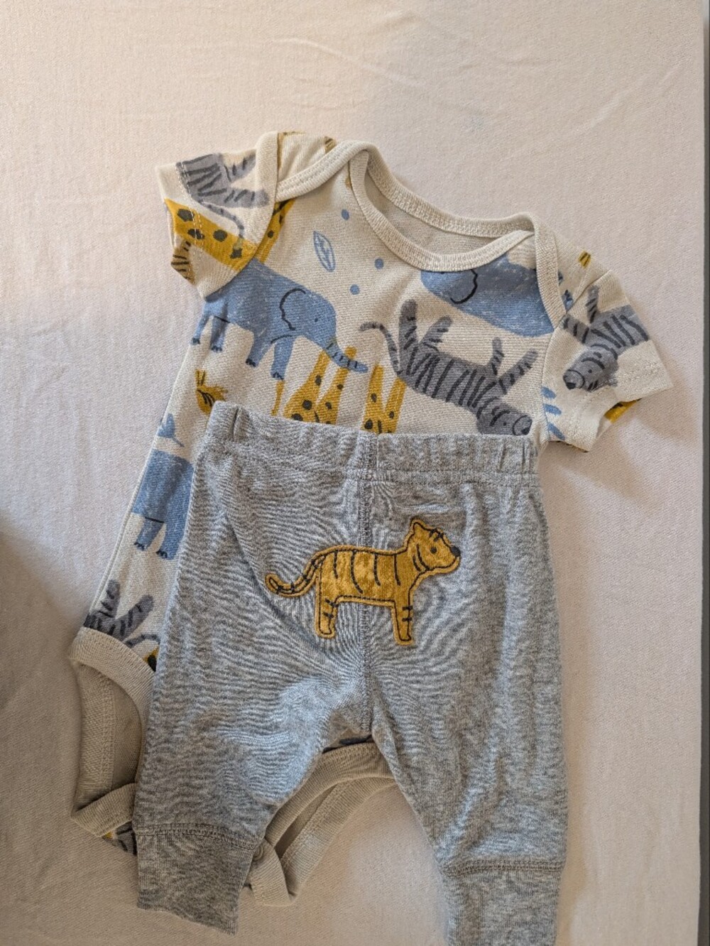 Carter's Cream and Blue Baby Onesie with Animal Prints